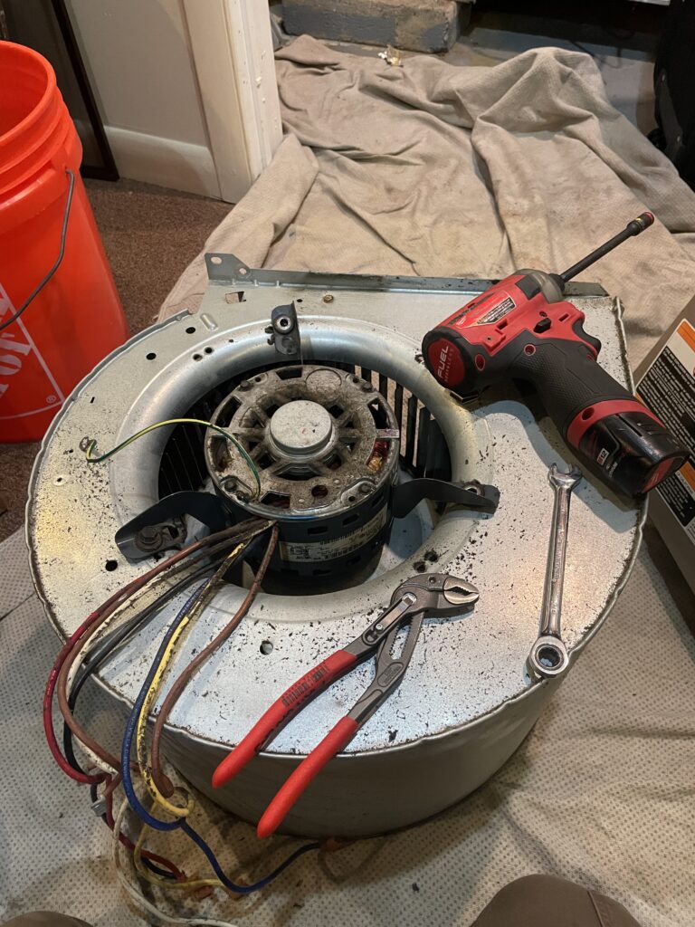 Old Blower motor in the fan assembly removed.