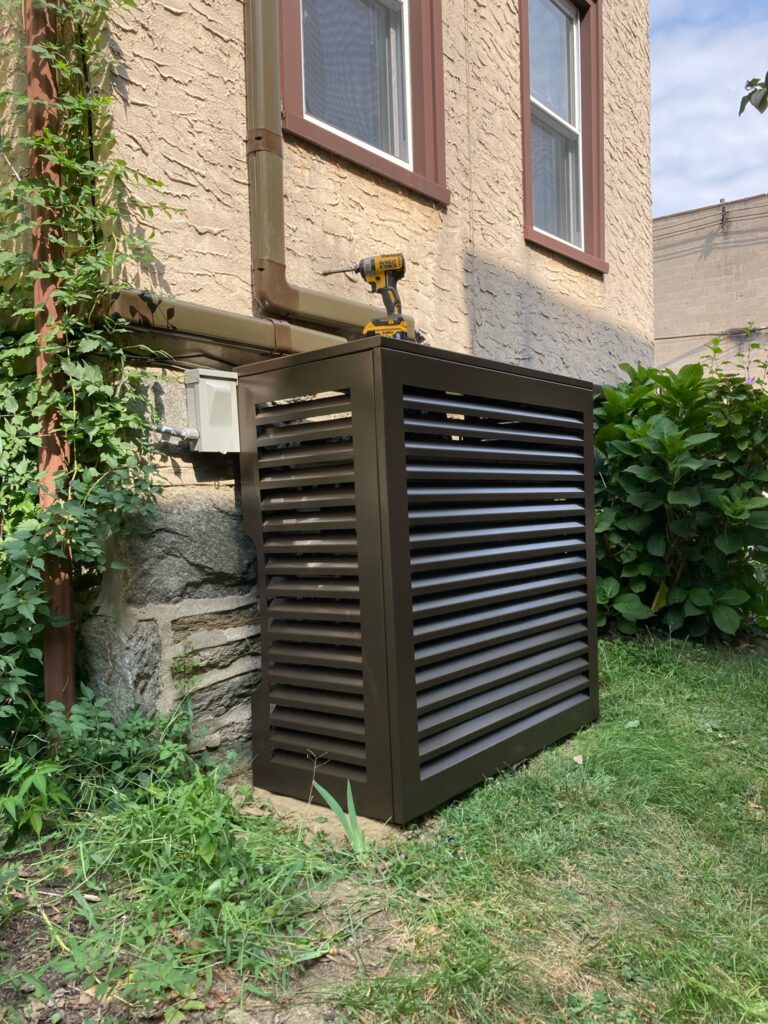 Cover hiding the Mitsubishi Mini split heat pump condenser. 