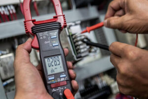 An electrician using a tool.