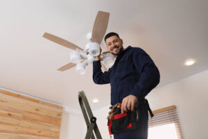 GEN3 electrician installing new ceiling fan.