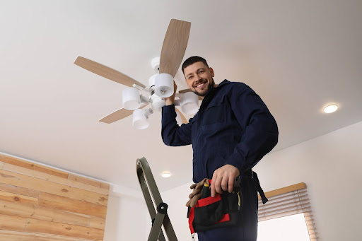 GEN3 electrician installing new ceiling fan.